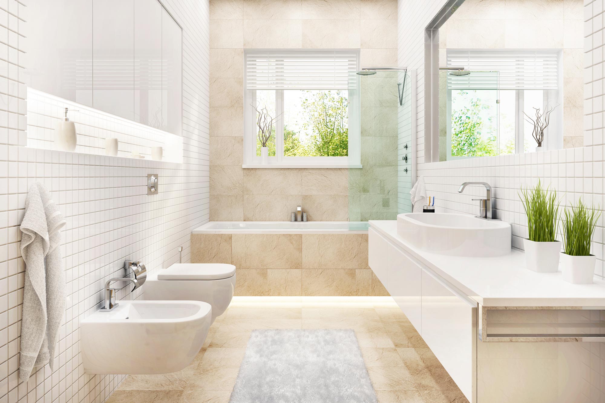 Ett elegant och modernt badrum inrett i ljusa toner med vita kakelplattor på väggarna och beige stengolv.